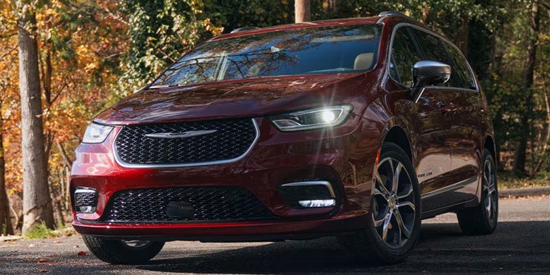 Front side view of Chrysler Pacifica minivan parked outdoors