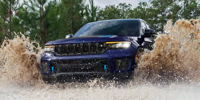 Front view of Jeep Grand Cherokee L driving through water