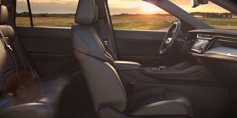 Interior view of front seats and dashboard in Jeep SUV