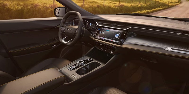 Interior view of dashboard and steering wheel in Jeep SUV