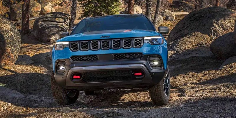 Front view of Jeep Compass driving off-road