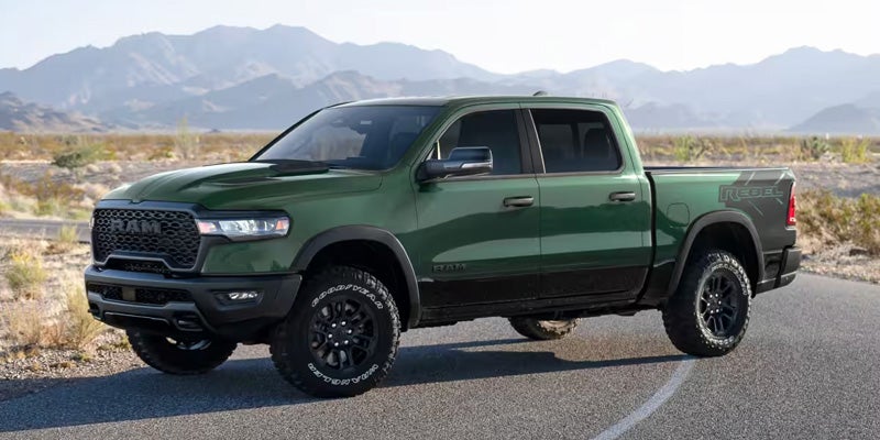 Front side view of Ram 1500 truck driving on road